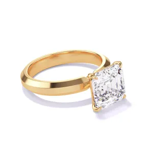 ASSCHER CUT DIAMOND ENGAGEMENT RING WITH A CLASSIC 4 PRONG THREE PHASES SETTING IN 18K YELLOW GOLD