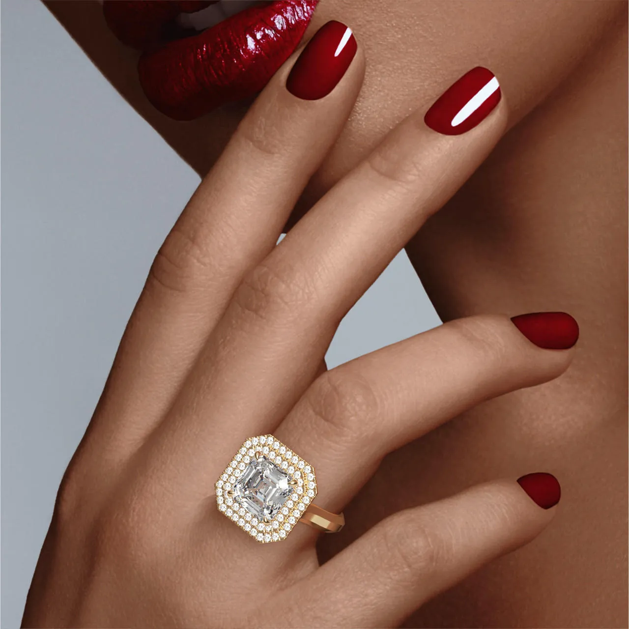 ASSCHER CUT DIAMOND ENGAGEMENT RING WITH A DOUBLE HALO THREE PHASES SETTING IN 18K YELLOW GOLD