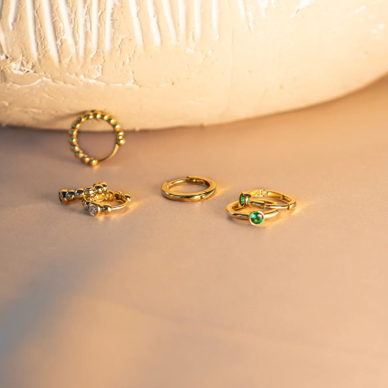 Bezel Set Emerald Huggie in  Gold