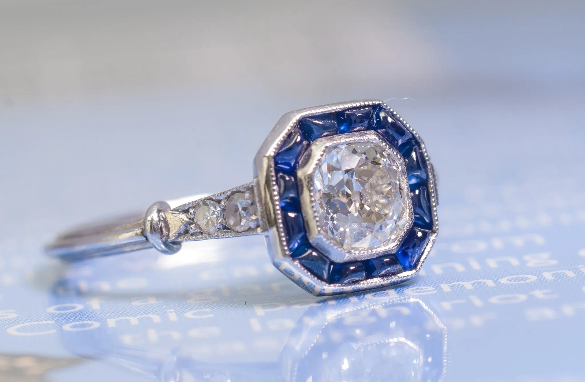 CABOCHON CUT SAPPHIRE AND OLD MINE CUT DIAMOND TARGET RING