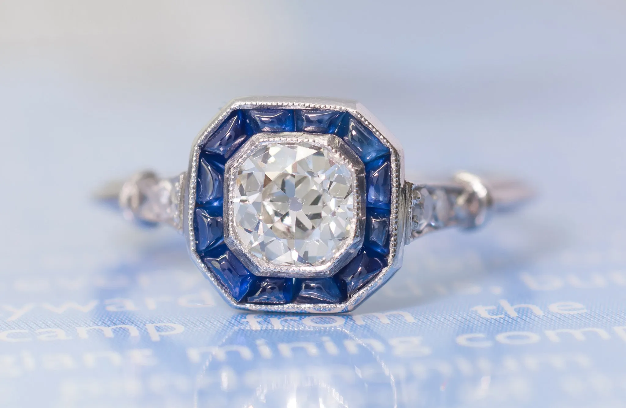 CABOCHON CUT SAPPHIRE AND OLD MINE CUT DIAMOND TARGET RING