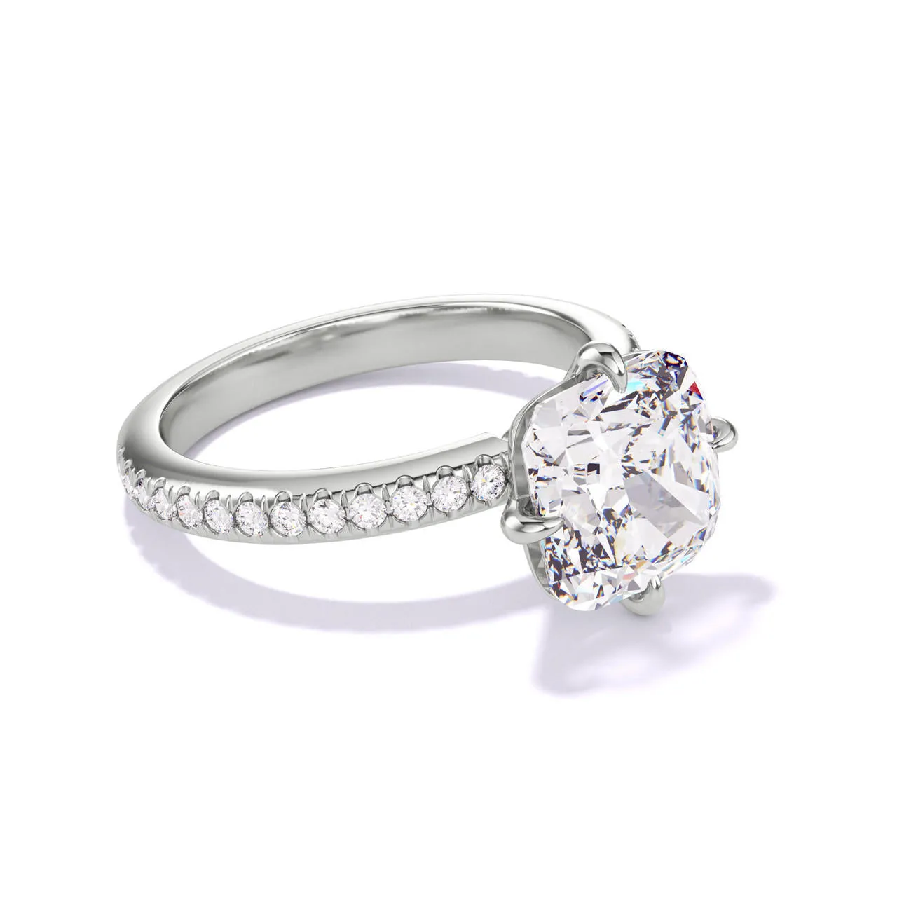 CUSHION CUT DIAMOND ENGAGEMENT RING WITH A COMPASS 4 PRONG THREE PHASES PAVE SETTING IN PLATINUM