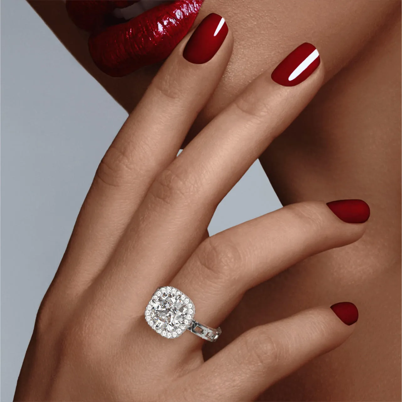 CUSHION CUT DIAMOND ENGAGEMENT RING WITH A WRAPPED HALO 16 LINKS SETTING IN PLATINUM