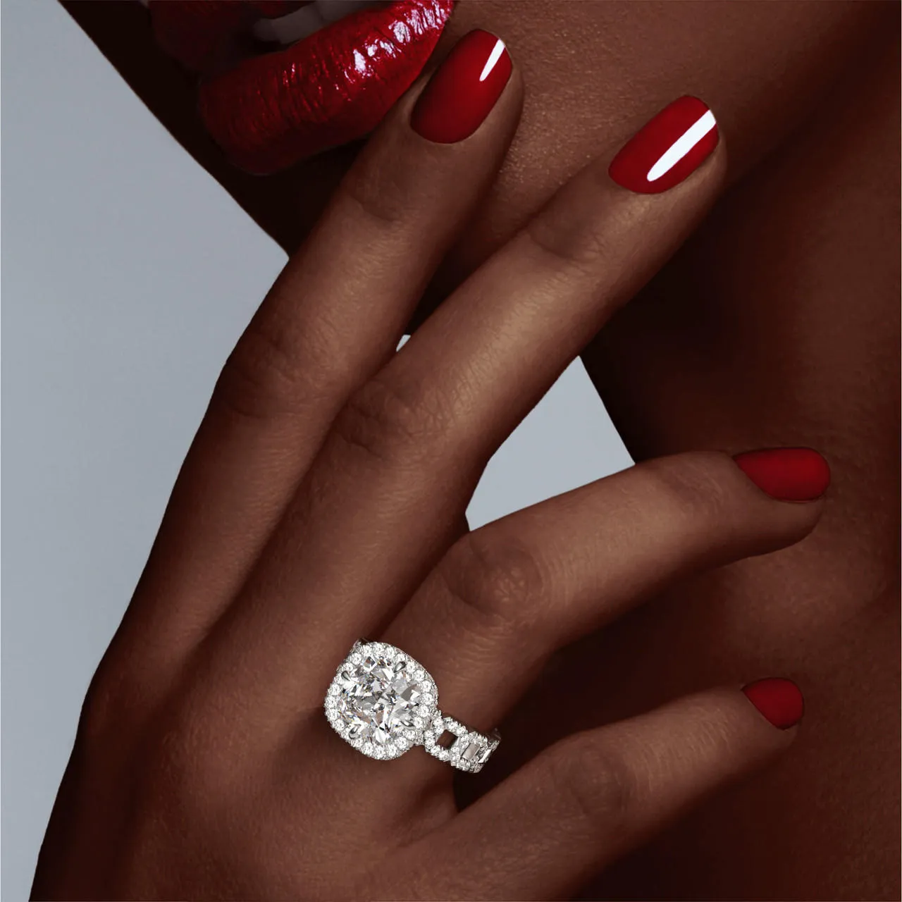 CUSHION CUT DIAMOND ENGAGEMENT RING WITH A WRAPPED HALO 16 PAVE LINKS SETTING IN PLATINUM