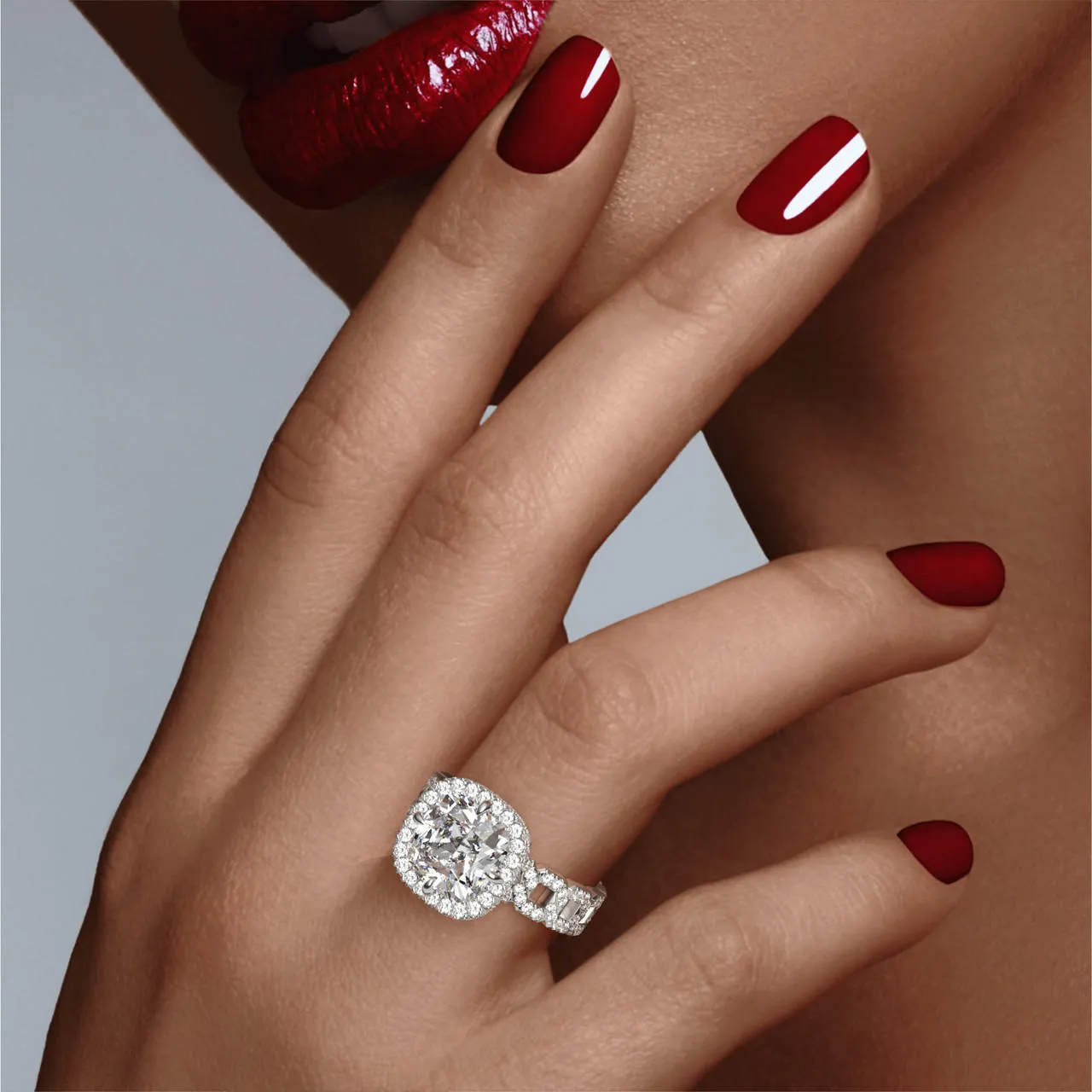 CUSHION CUT DIAMOND ENGAGEMENT RING WITH A WRAPPED HALO 16 PAVE LINKS SETTING IN PLATINUM