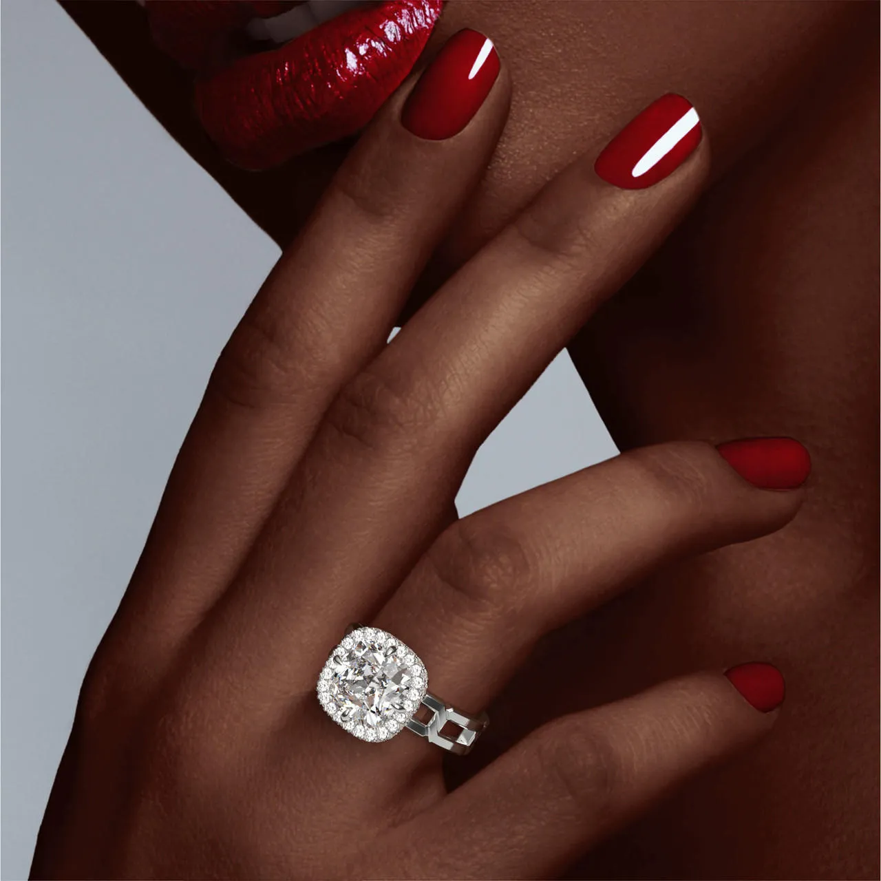 CUSHION CUT DIAMOND ENGAGEMENT RING WITH A WRAPPED HALO 8 LINKS SETTING IN PLATINUM