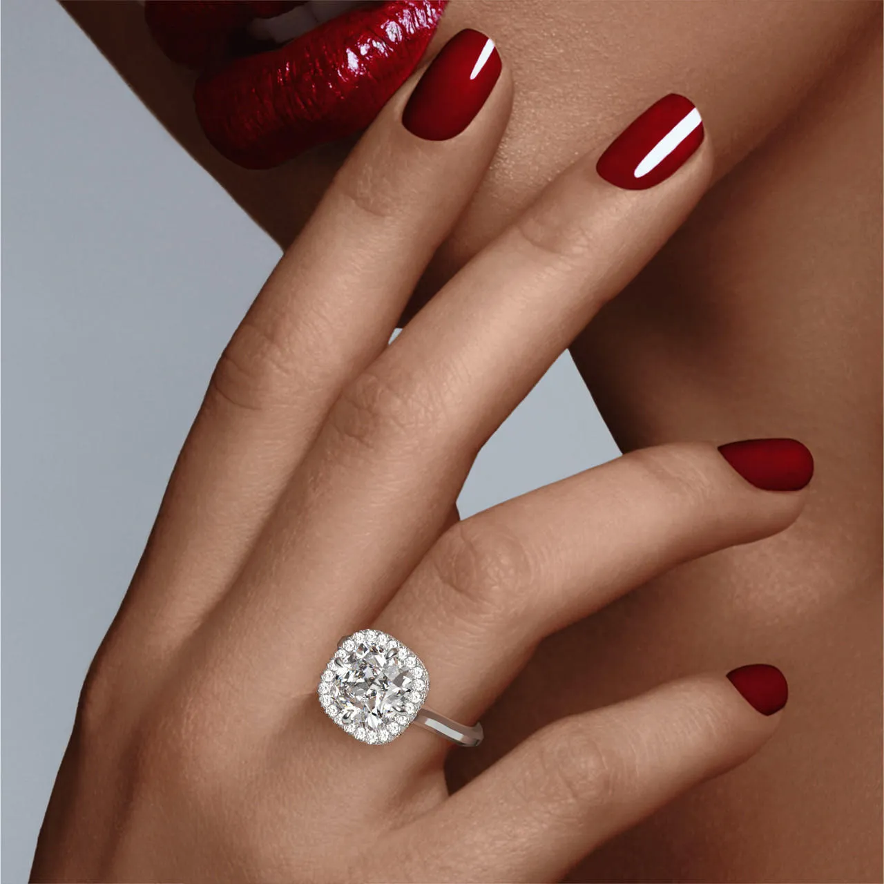 CUSHION CUT DIAMOND ENGAGEMENT RING WITH A WRAPPED HALO THREE PHASES SLIM SETTING IN PLATINUM