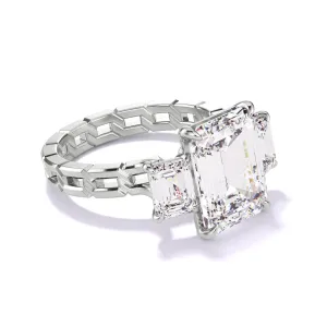 EMERALD CUT DIAMOND ENGAGEMENT RING WITH A THREE STONE 16 LINKS SETTING IN PLATINUM