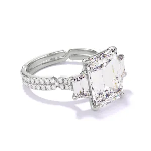 EMERALD CUT DIAMOND ENGAGEMENT RING WITH A TRAPEZOID FLANK CHANCE PAVE SETTING IN PLATINUM
