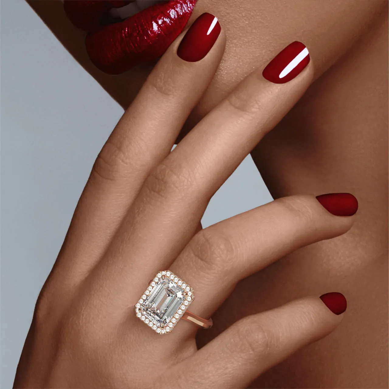 EMERALD CUT DIAMOND ENGAGEMENT RING WITH A WRAPPED HALO THREE PHASES SLIM SETTING IN 18K ROSE GOLD