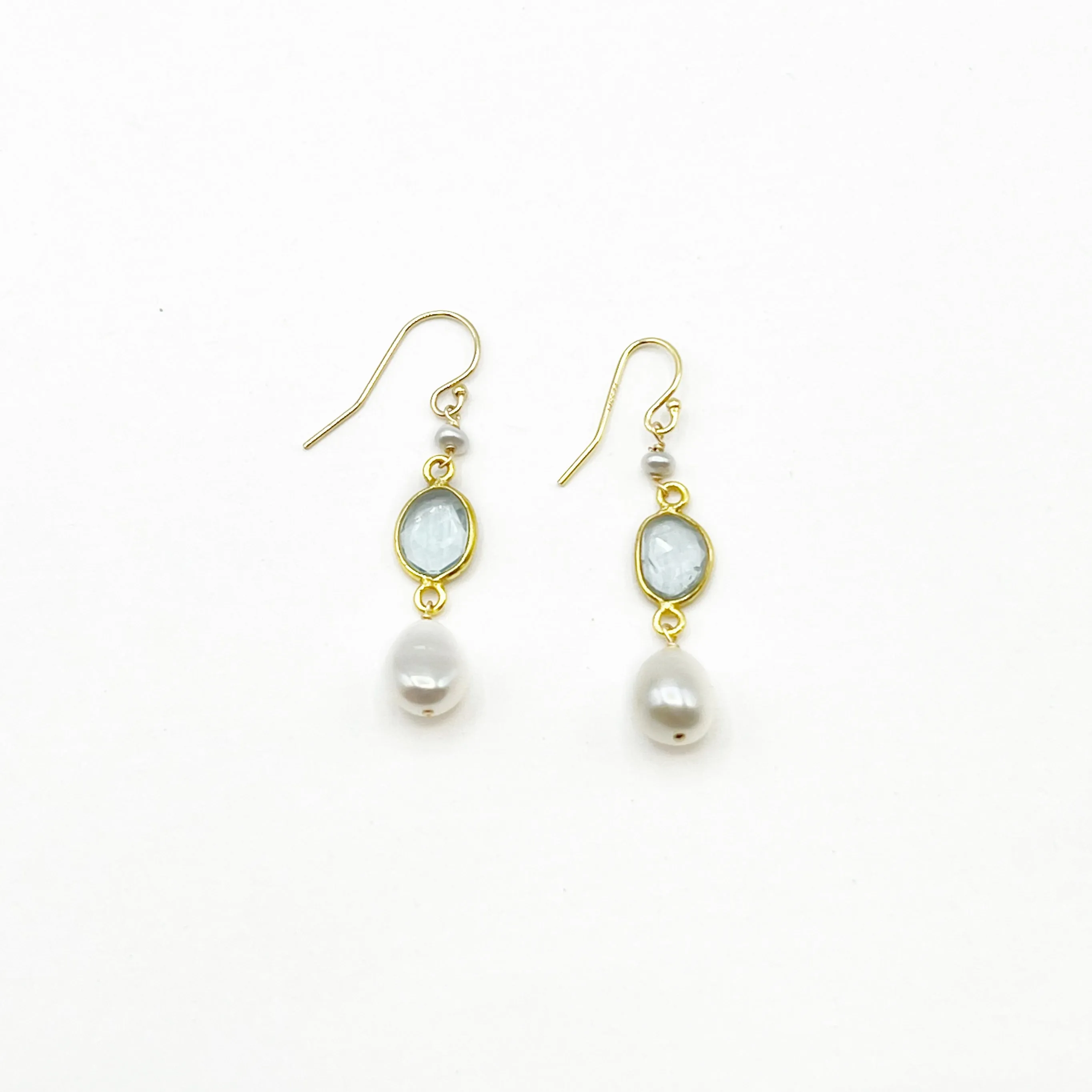 Light Blue Topaz and Pearl set in Gold