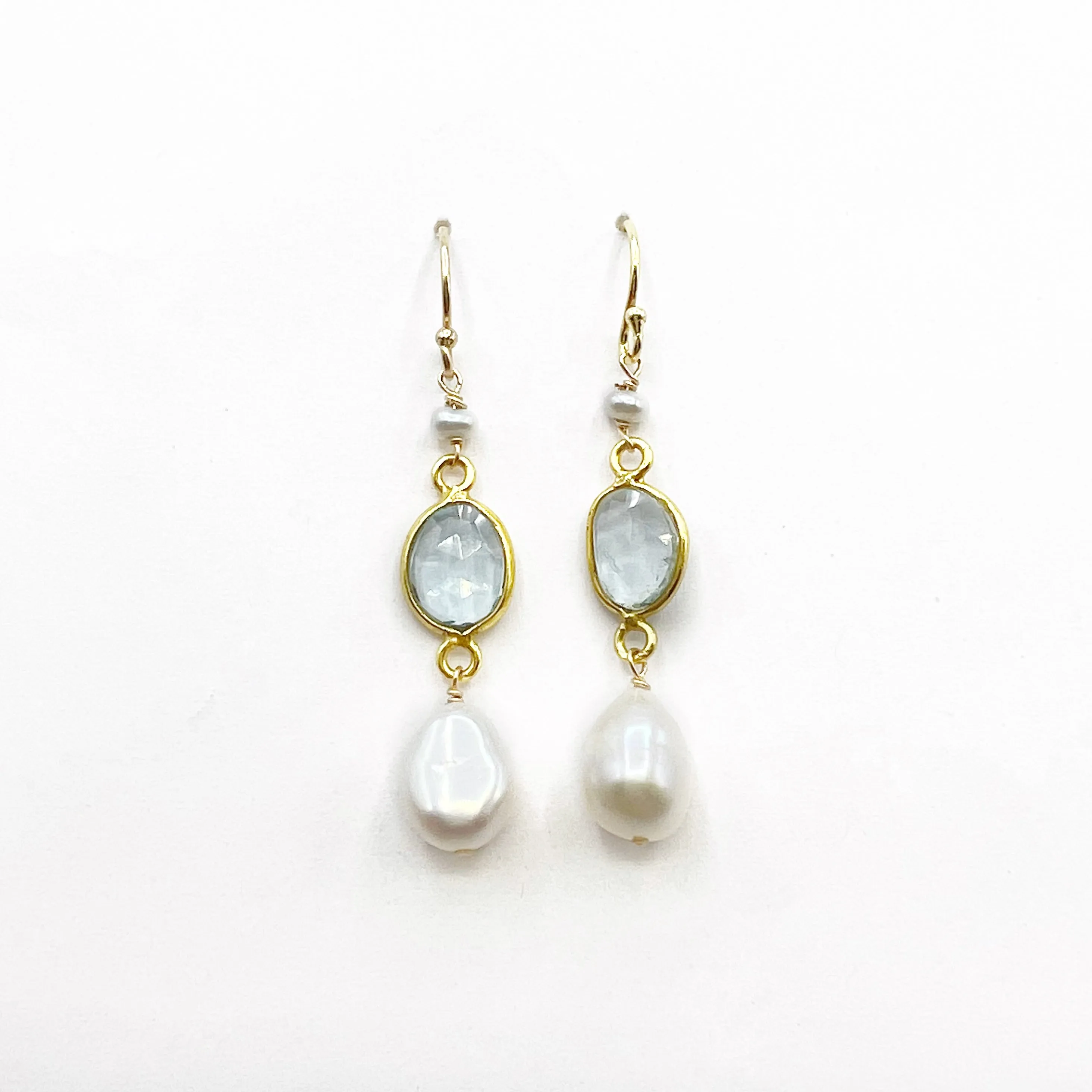 Light Blue Topaz and Pearl set in Gold