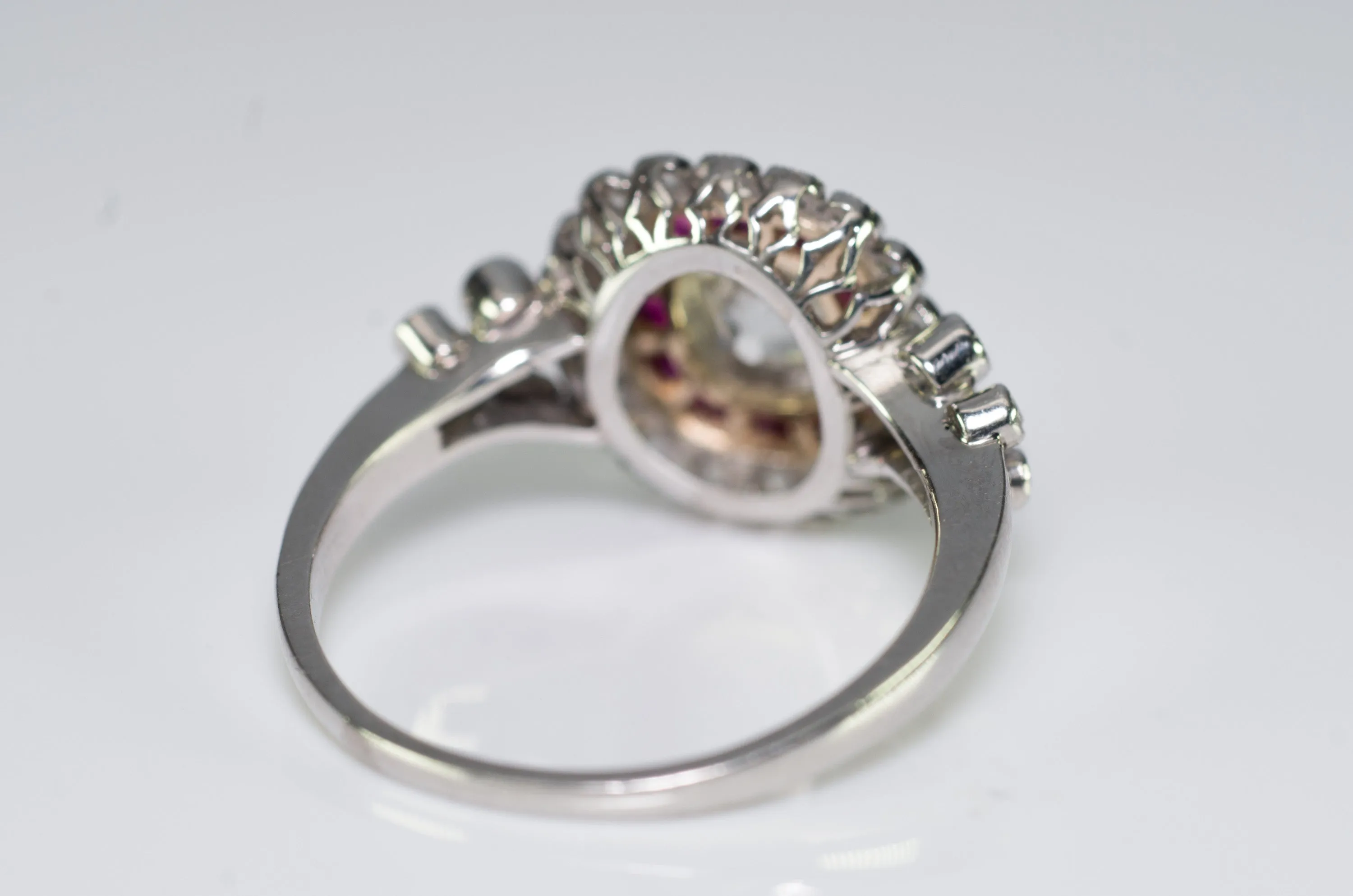 OLD CUSHION CUT DIAMOND AND RUBY HALO RING