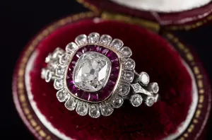 OLD CUSHION CUT DIAMOND AND RUBY HALO RING