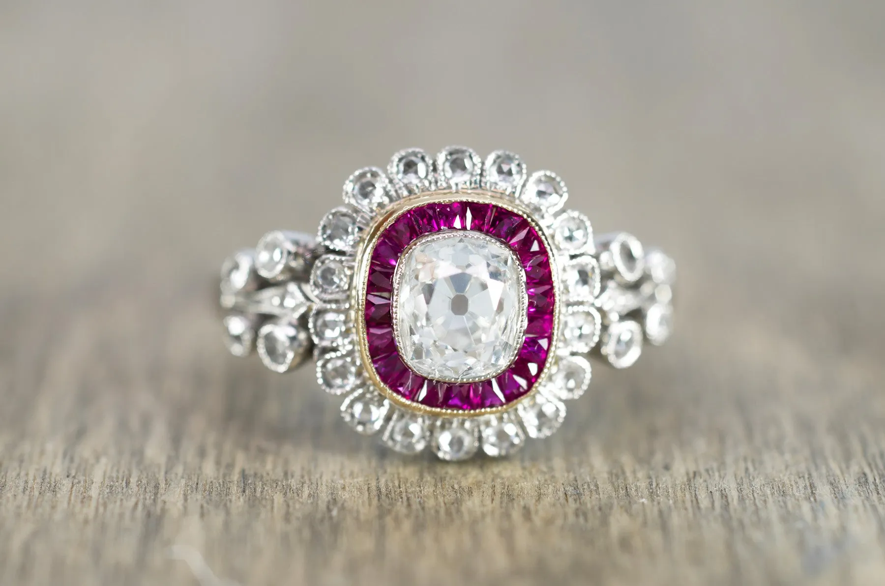 OLD CUSHION CUT DIAMOND AND RUBY HALO RING