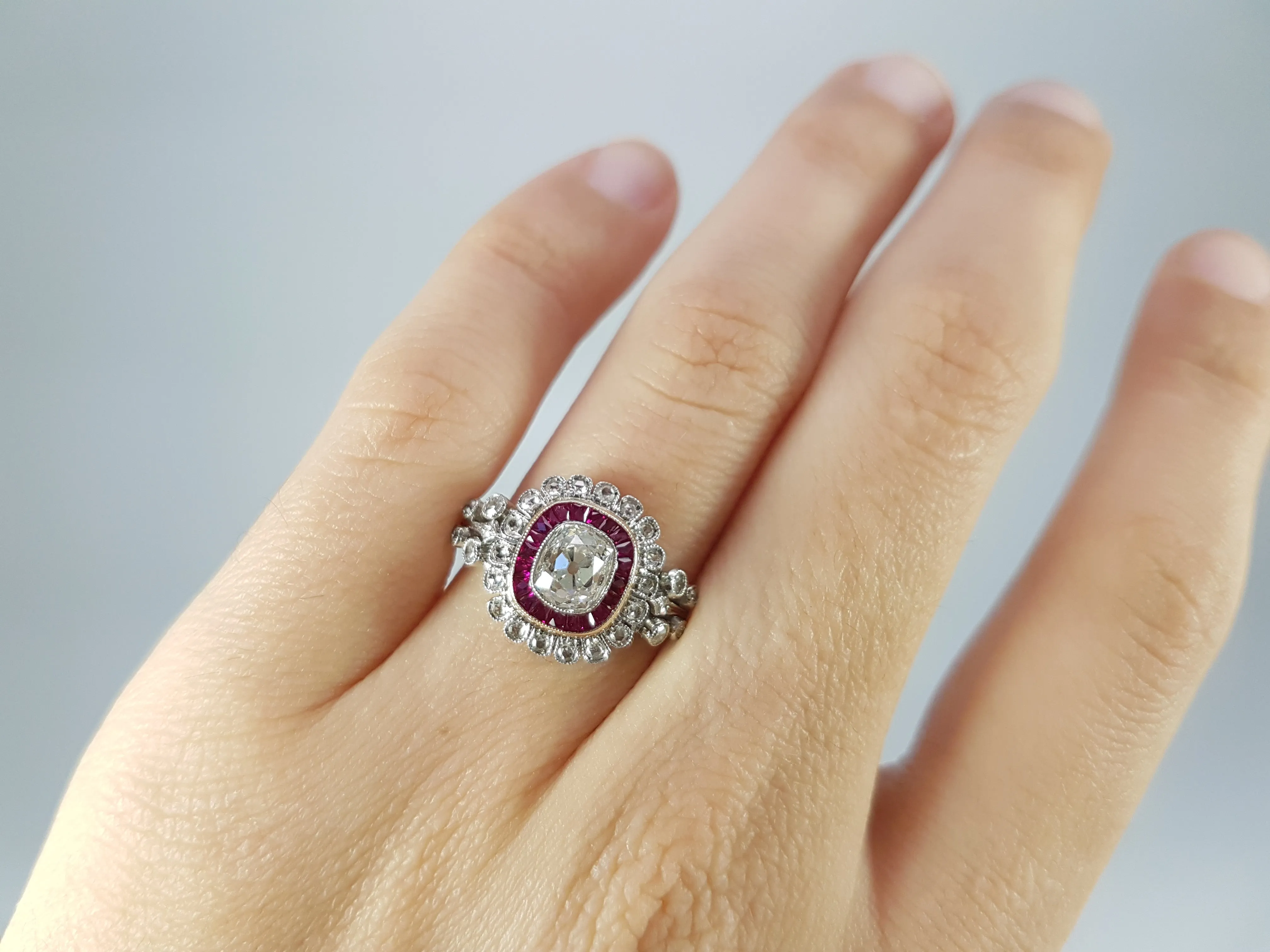 OLD CUSHION CUT DIAMOND AND RUBY HALO RING