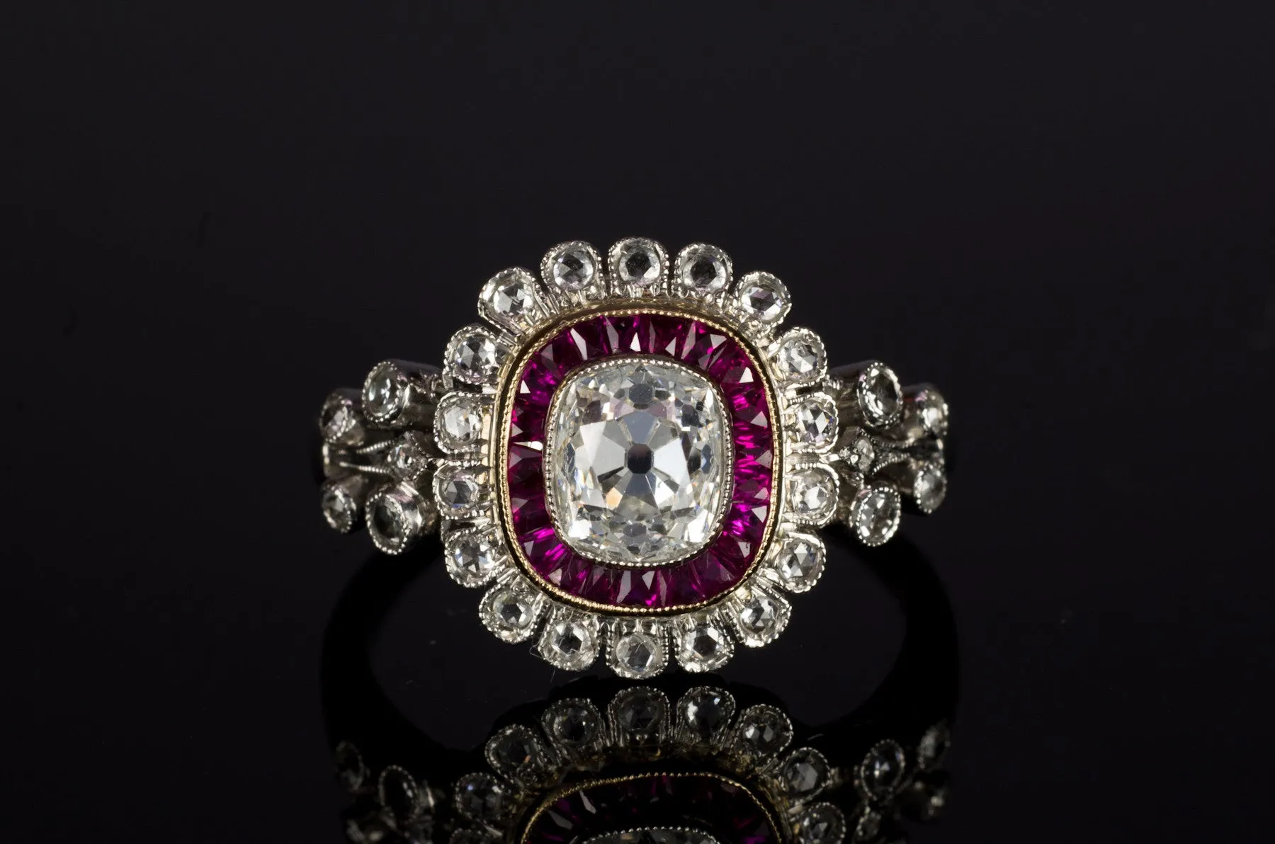 OLD CUSHION CUT DIAMOND AND RUBY HALO RING