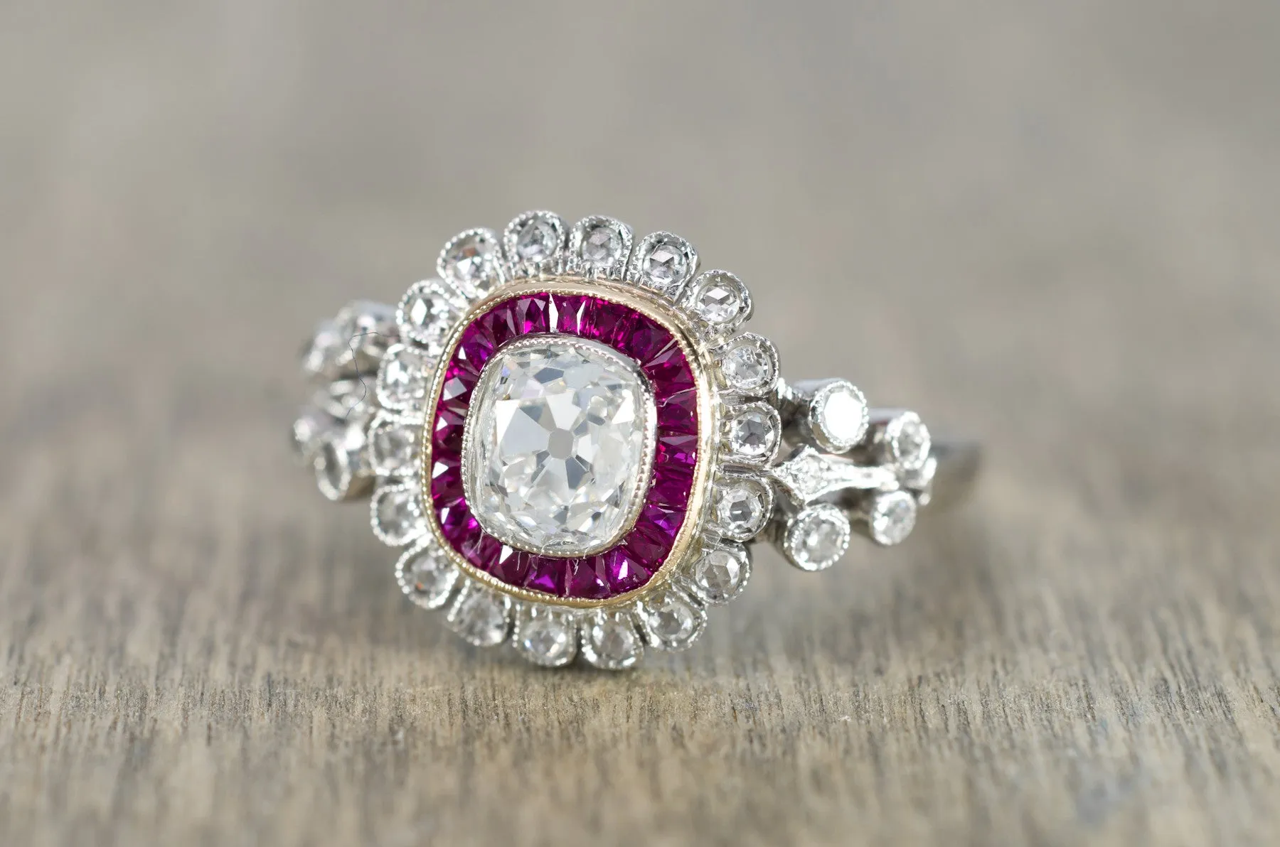 OLD CUSHION CUT DIAMOND AND RUBY HALO RING