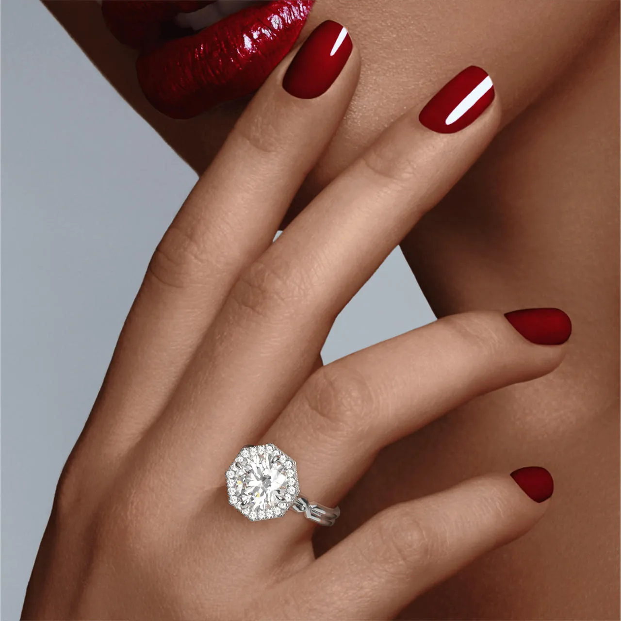 ROUND CUT DIAMOND ENGAGEMENT RING WITH AN OCTAGON HALO CHANCE SETTING IN PLATINUM